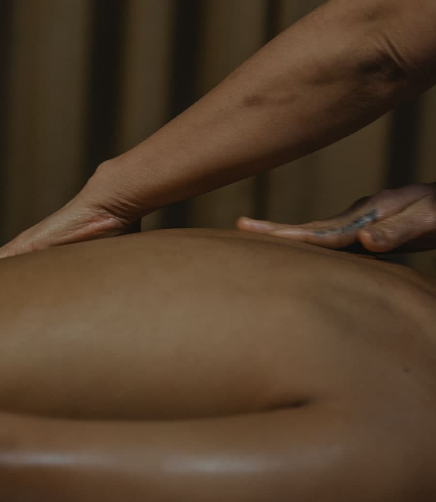 A therapist giving a hands-on back massage